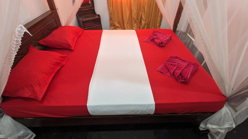 Postel nebo postele na pokoji v ubytování Mirissa Senaliya Guest