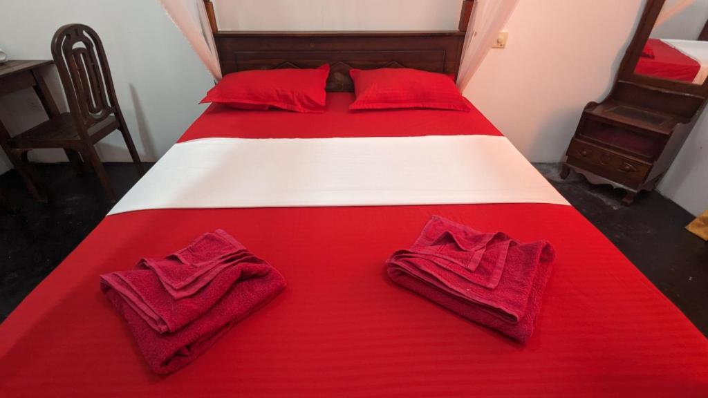 Postel nebo postele na pokoji v ubytování Mirissa Senaliya Guest