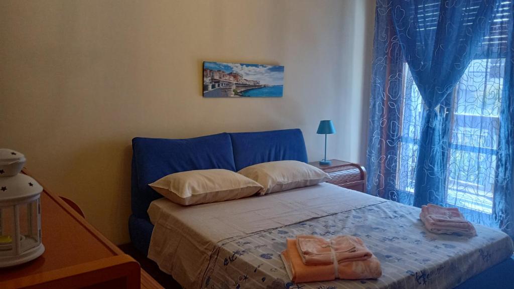 Ένα ή περισσότερα κρεβάτια σε δωμάτιο στο Mama's House