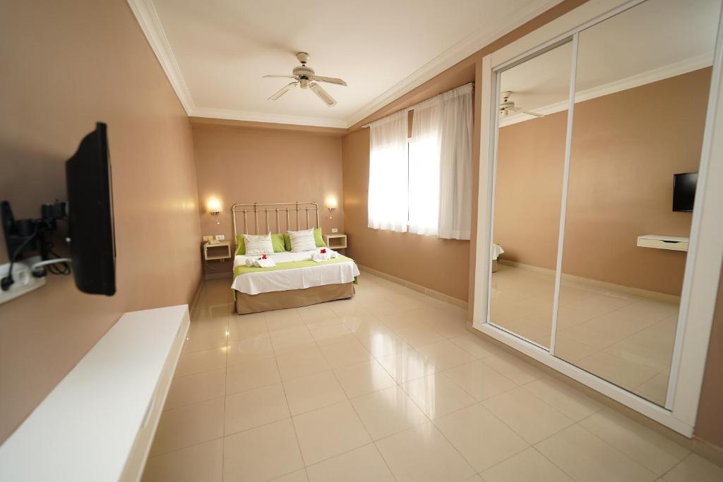 Postel nebo postele na pokoji v ubytování Hotel RF Astoria - Adults Only