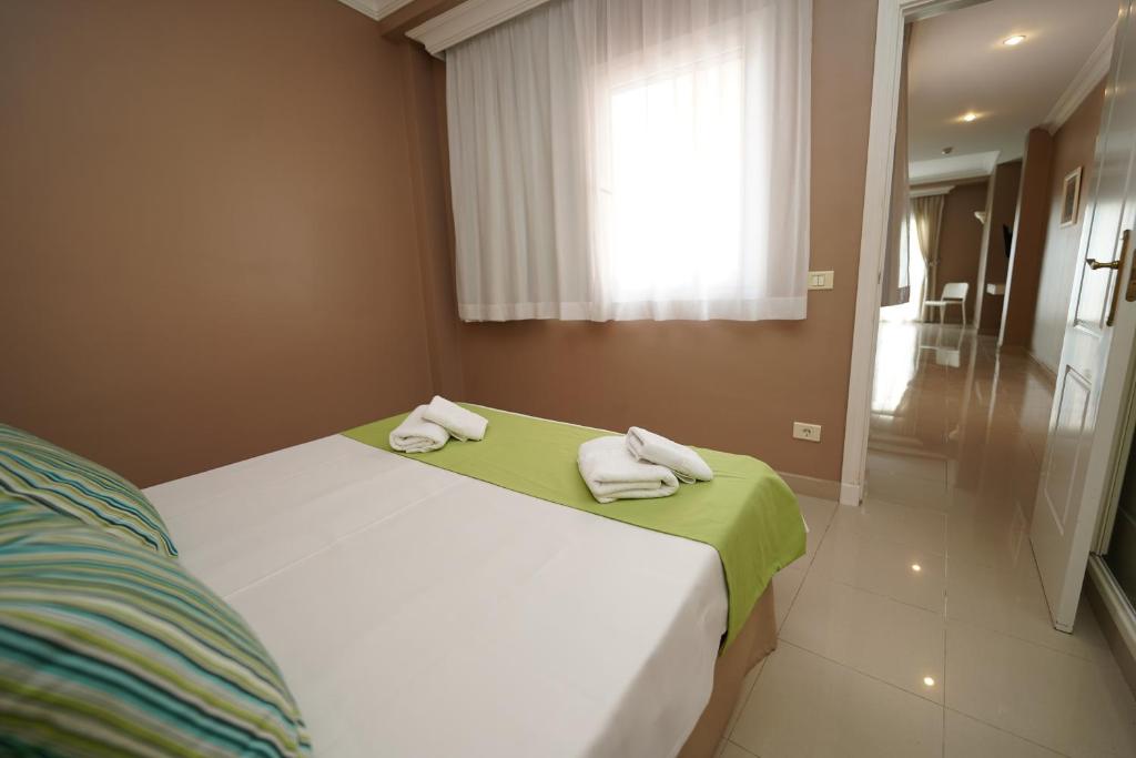 Postel nebo postele na pokoji v ubytování Hotel RF Astoria - Adults Only