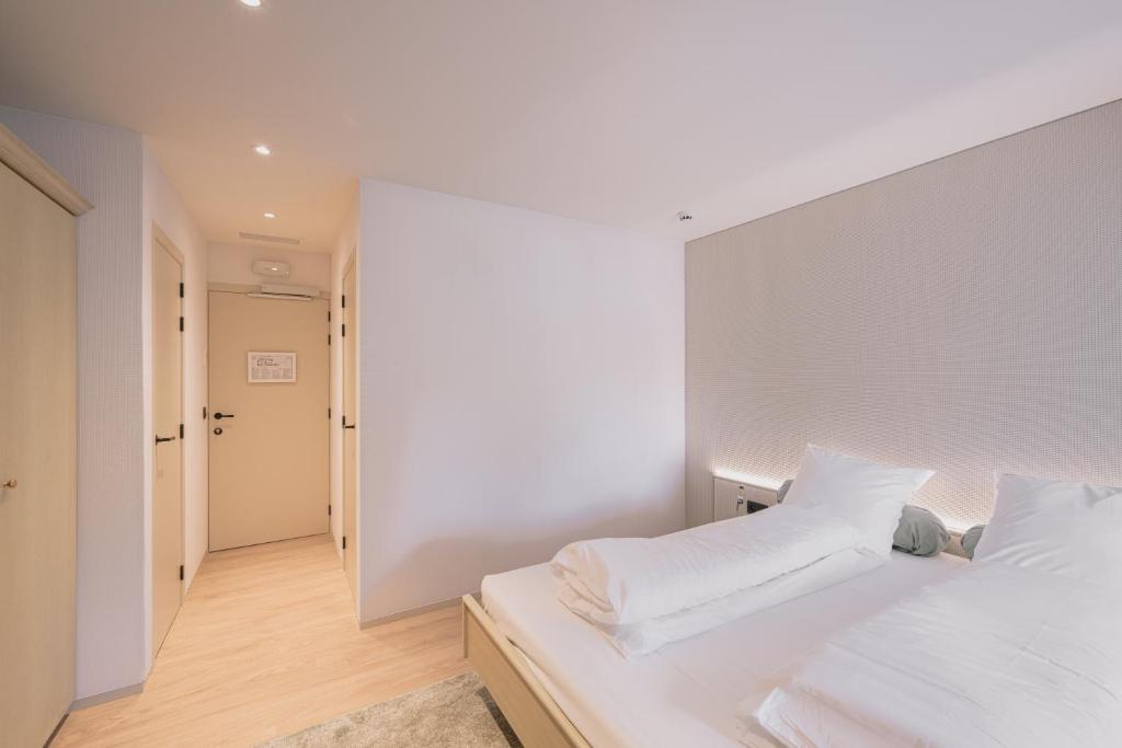 Postel nebo postele na pokoji v ubytování Hotel De Baian