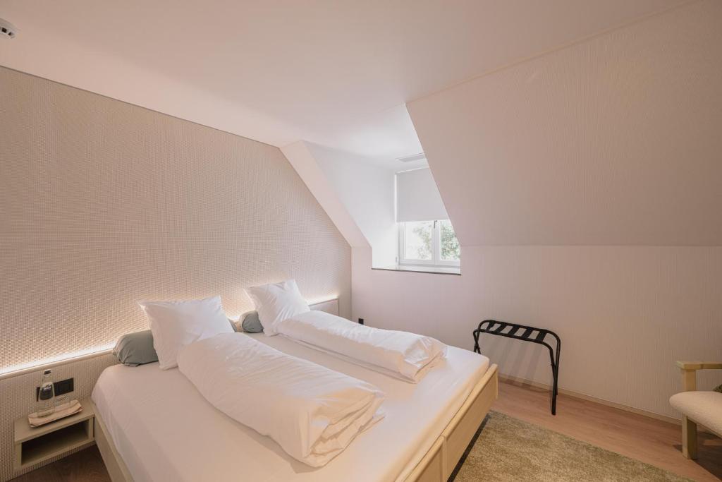 Postel nebo postele na pokoji v ubytování Hotel De Baian