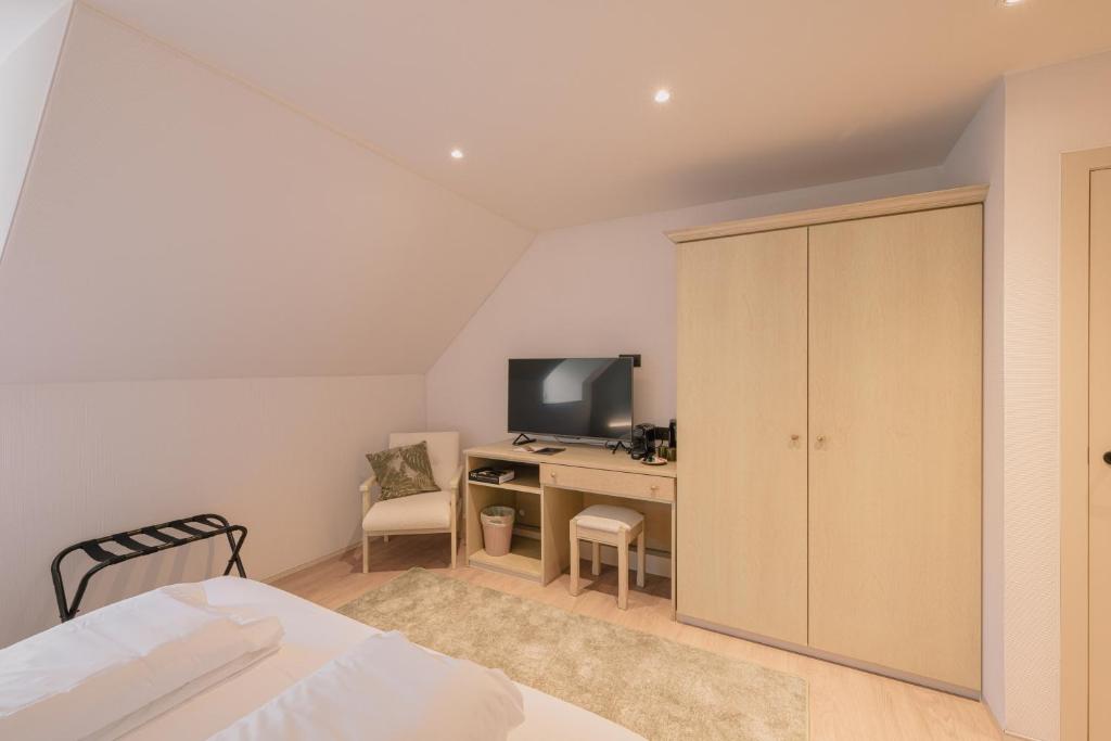 TV a/nebo společenská místnost v ubytování Hotel De Baian