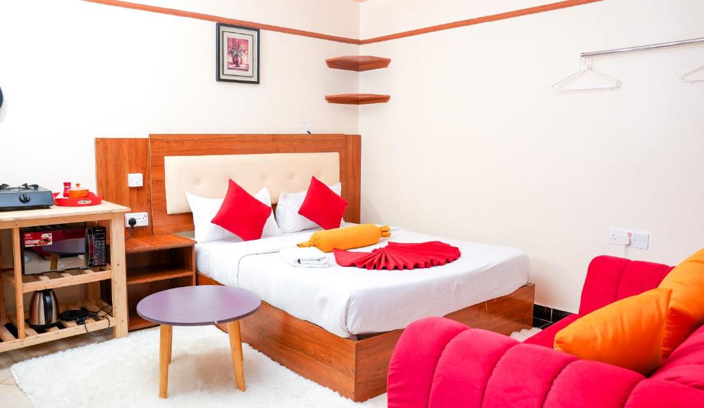 Giường trong phòng chung tại Shalom Apartments Naivasha Town