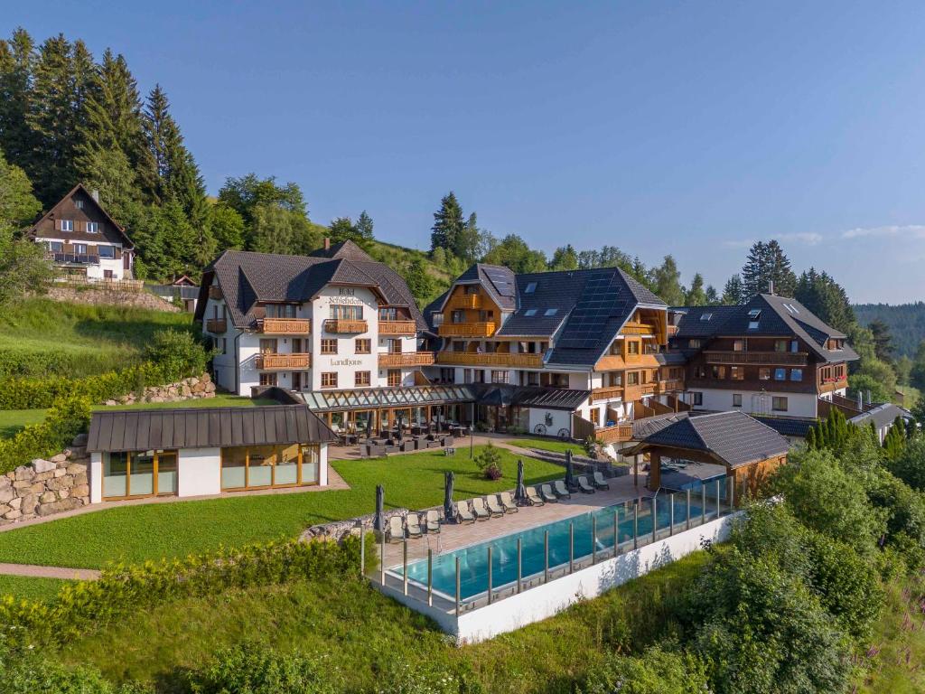 an aerial view of a house with a swimming pool at Hotel Schlehdorn in Feldberg