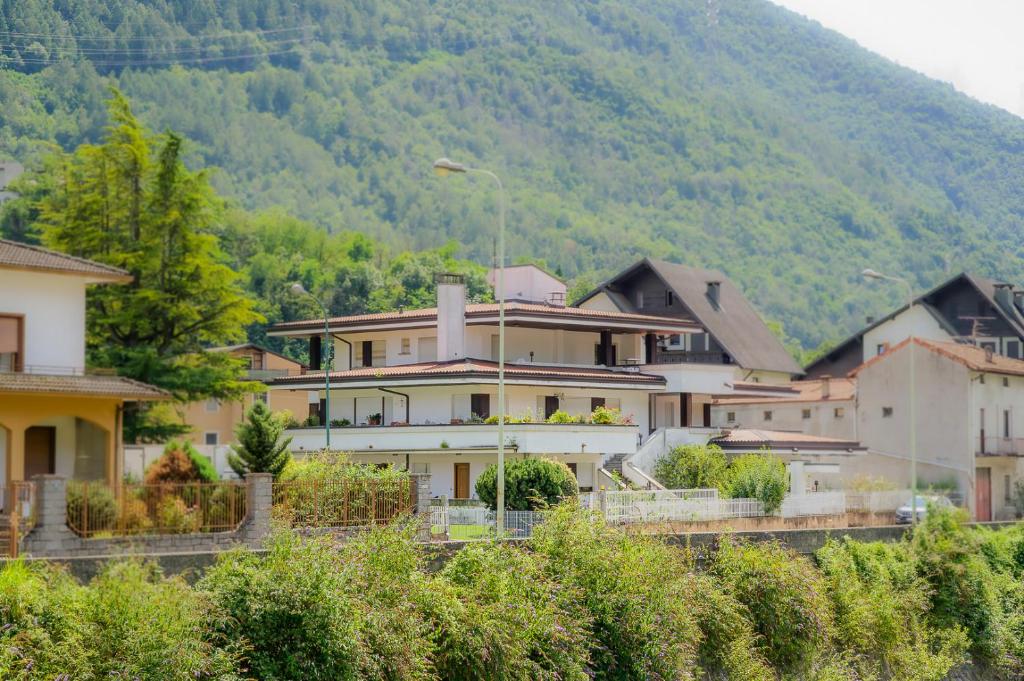 a group of houses in front of a mountain at Casa dei Pini in Tirano