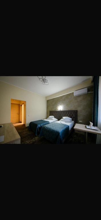 Postel nebo postele na pokoji v ubytování Hotel Tiara