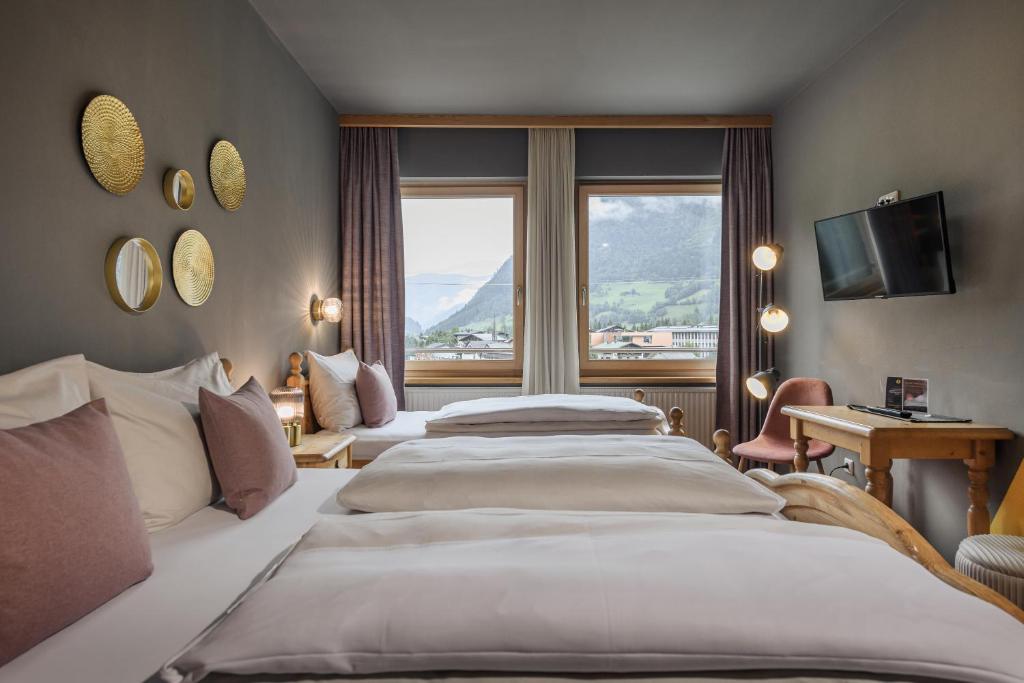 Ένα ή περισσότερα κρεβάτια σε δωμάτιο στο B&B Berglift direkt an der Talstation