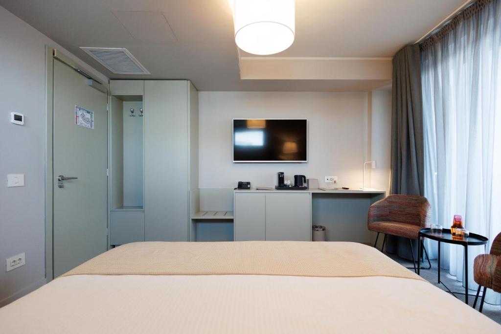 TV a/nebo společenská místnost v ubytování Millennium Hub & Hotel