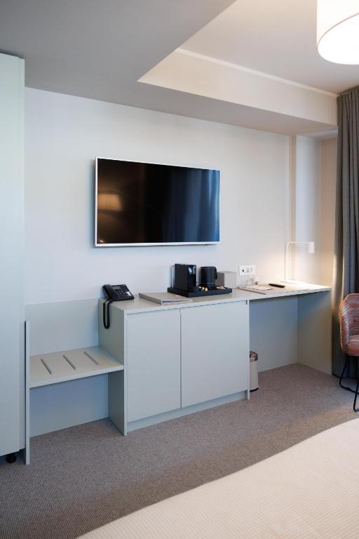 TV a/nebo společenská místnost v ubytování Millennium Hub & Hotel
