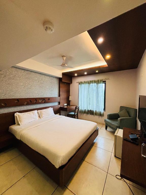 Postel nebo postele na pokoji v ubytování Hotel Kanan