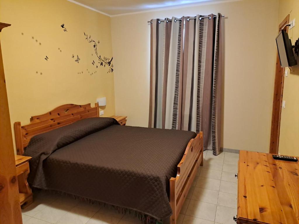 Postel nebo postele na pokoji v ubytování Grotta dei Colombi