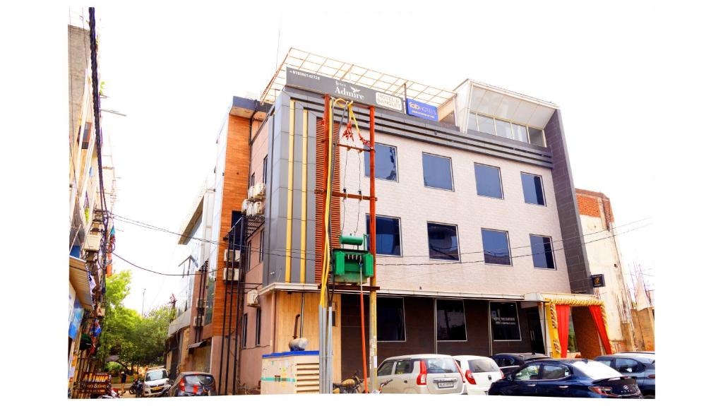 a building under construction with cars parked in front of it at Hotel The Emporio A Corporate suites in Ghaziabad