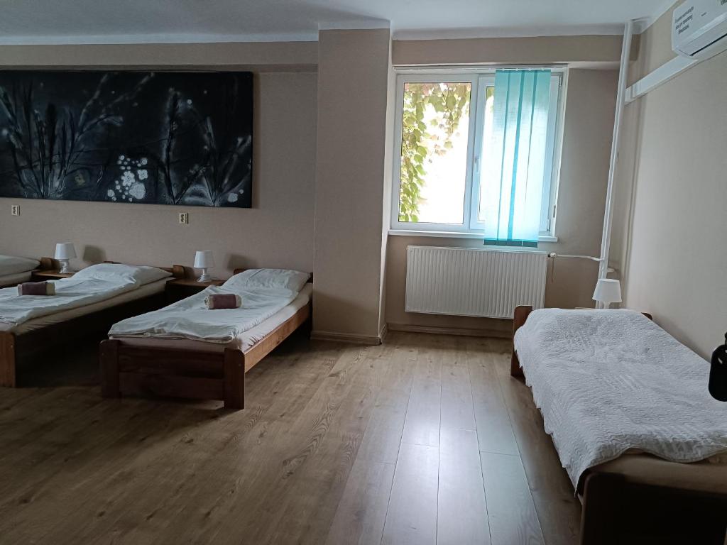 Posteľ alebo postele v izbe v ubytovaní Penzion Flipper