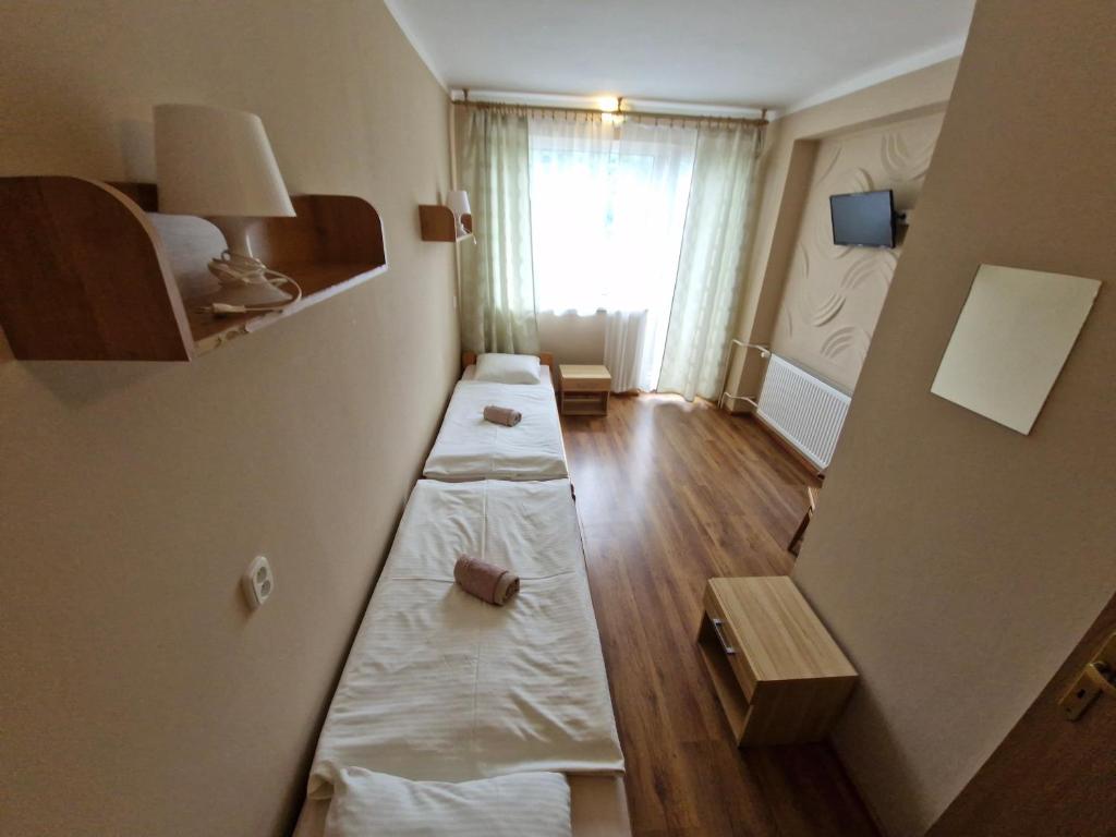 Posteľ alebo postele v izbe v ubytovaní Penzion Flipper