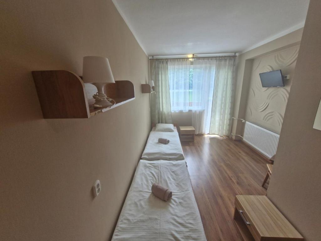 Posteľ alebo postele v izbe v ubytovaní Penzion Flipper
