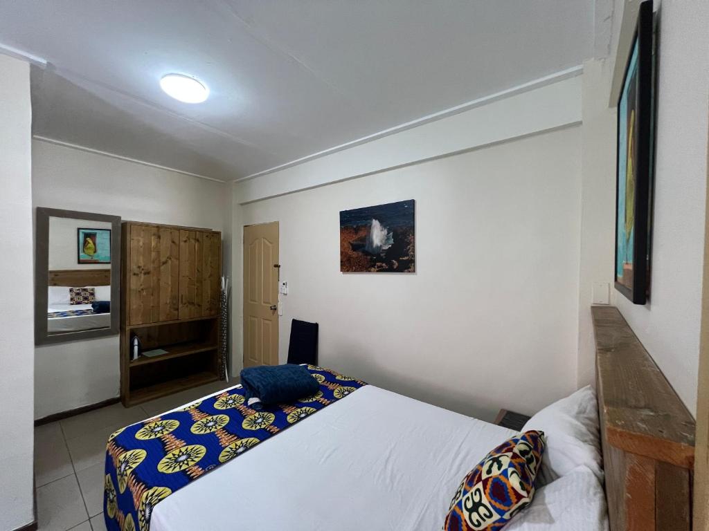 Postel nebo postele na pokoji v ubytování Mustique Suites Curacao