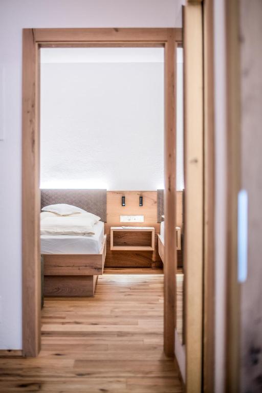 Postel nebo postele na pokoji v ubytování Hotel Sterzinger Moos