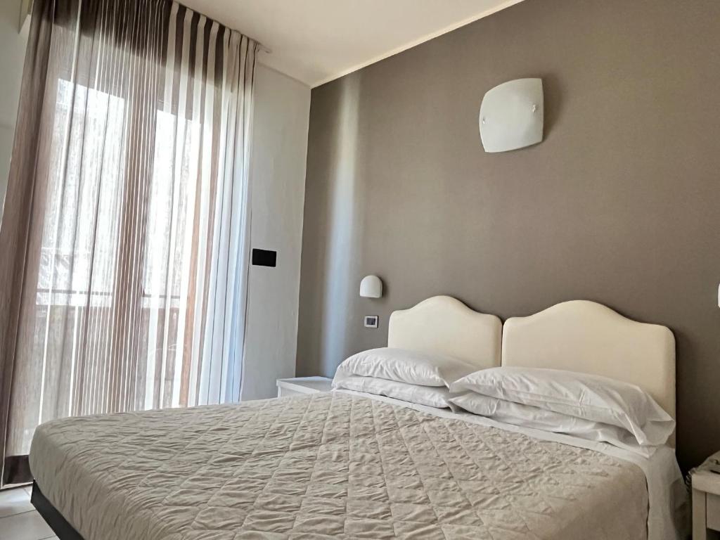 Postel nebo postele na pokoji v ubytování Hotel Berenice