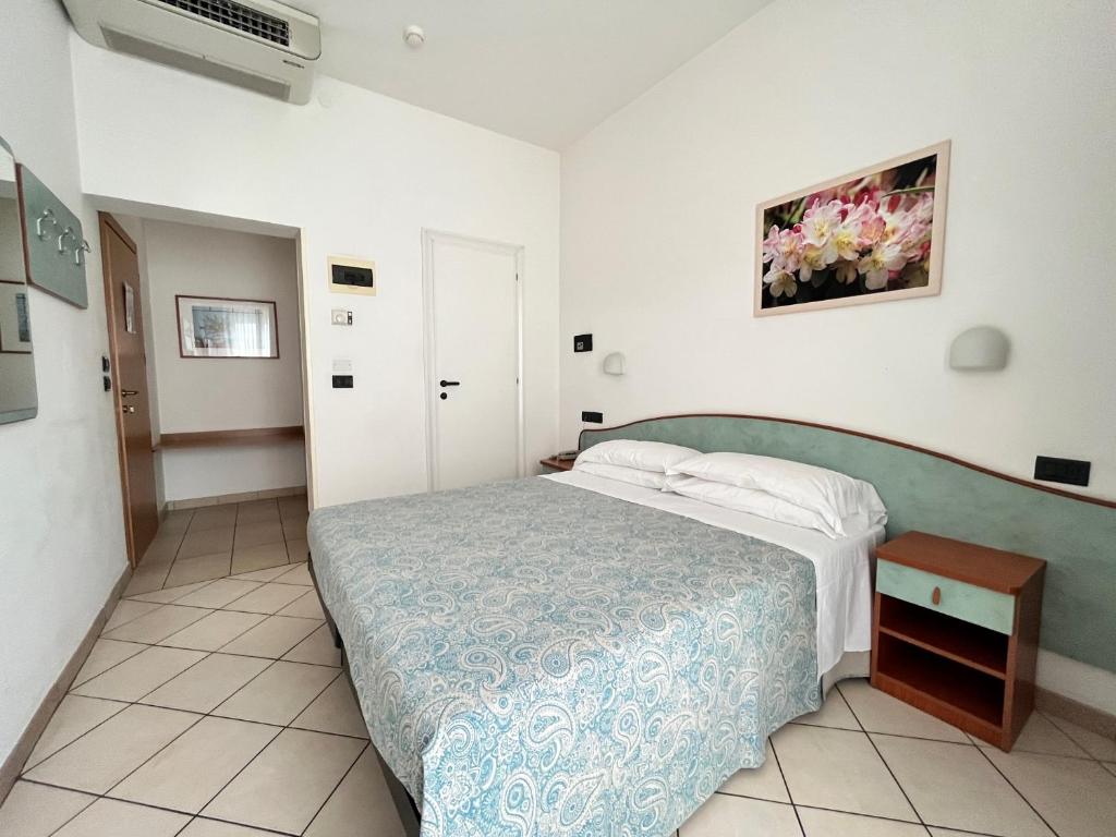 Postel nebo postele na pokoji v ubytování Hotel Berenice