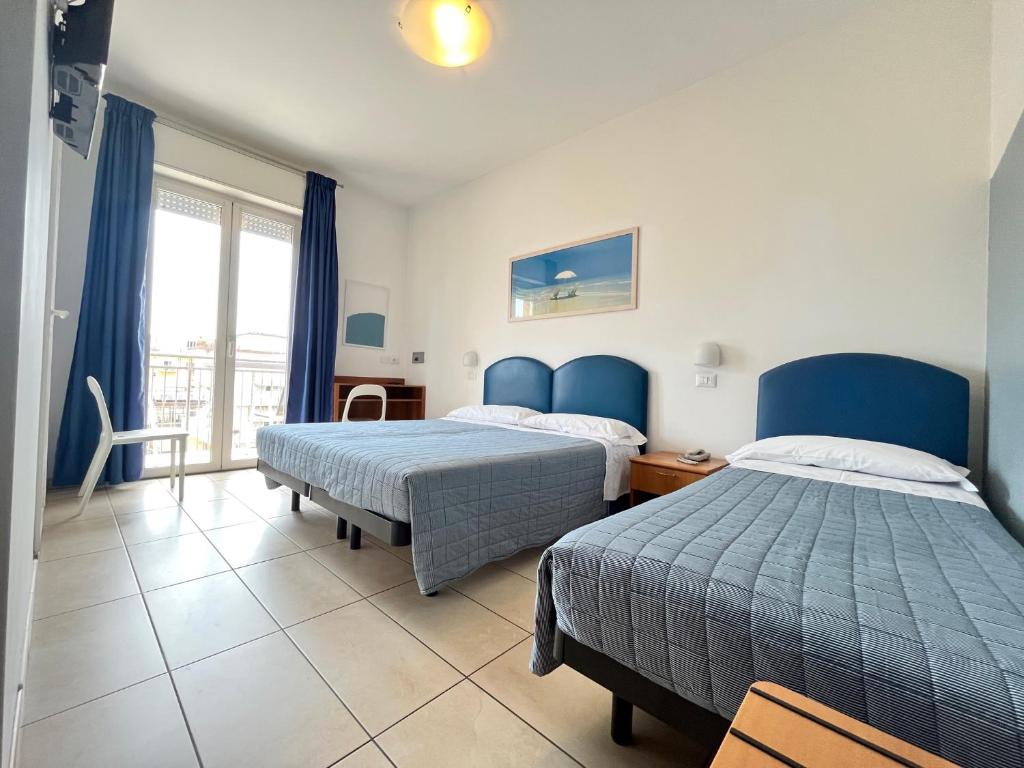 Postel nebo postele na pokoji v ubytování Hotel Berenice