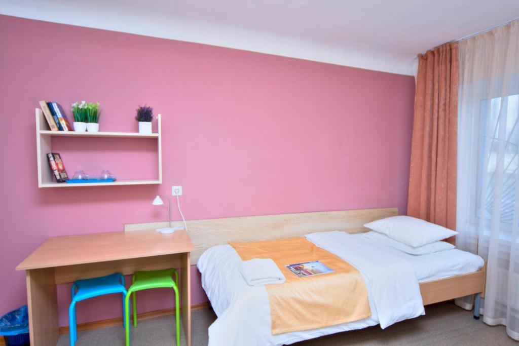 Postel nebo postele na pokoji v ubytování Podolski Hostel