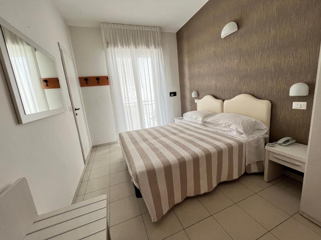 Postel nebo postele na pokoji v ubytování Hotel Berenice