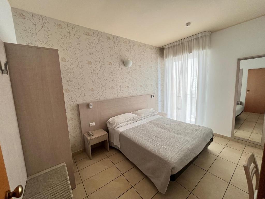 Postel nebo postele na pokoji v ubytování Hotel Berenice