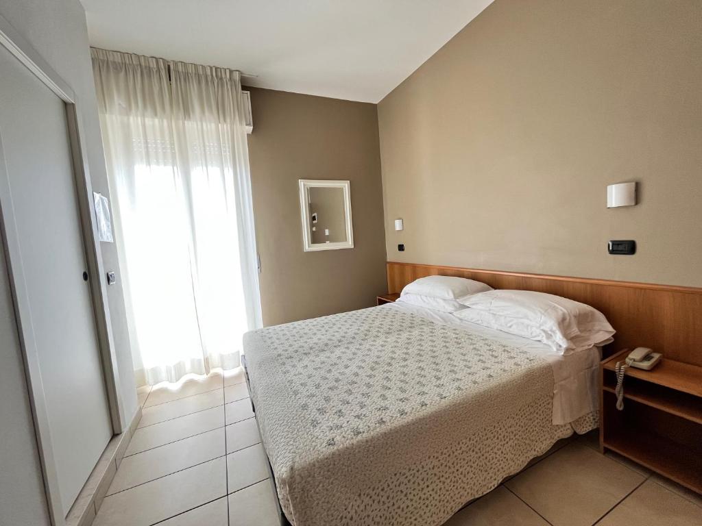 Postel nebo postele na pokoji v ubytování Hotel Berenice