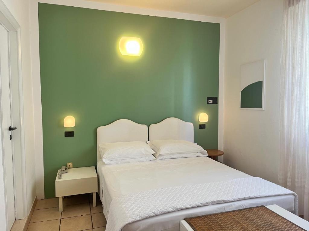 Postel nebo postele na pokoji v ubytování Hotel Berenice
