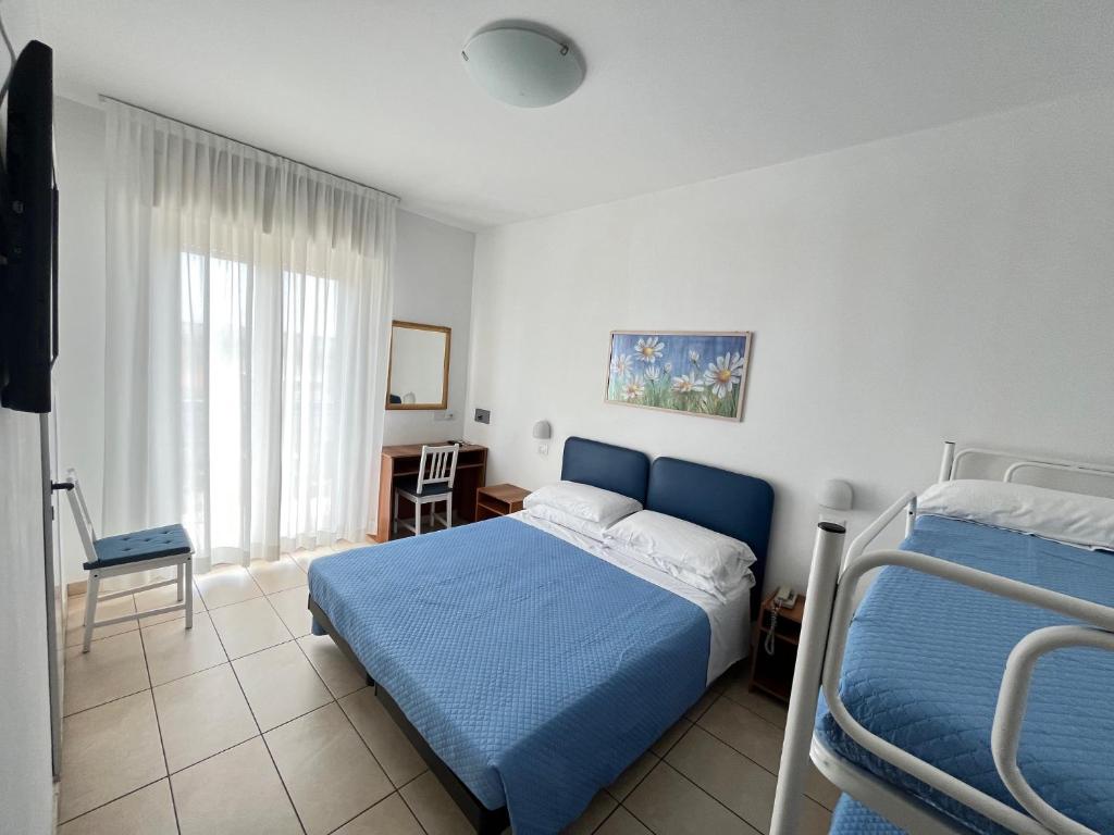 Postel nebo postele na pokoji v ubytování Hotel Berenice