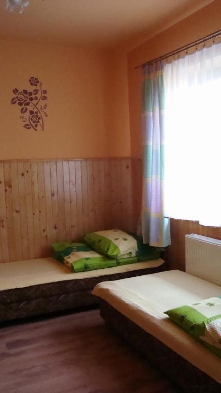 Posteľ alebo postele v izbe v ubytovaní Pokoje Zakopane