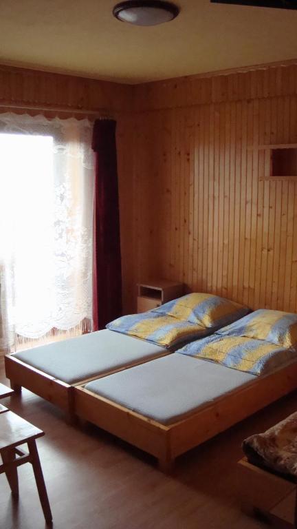 Posteľ alebo postele v izbe v ubytovaní Pokoje Zakopane