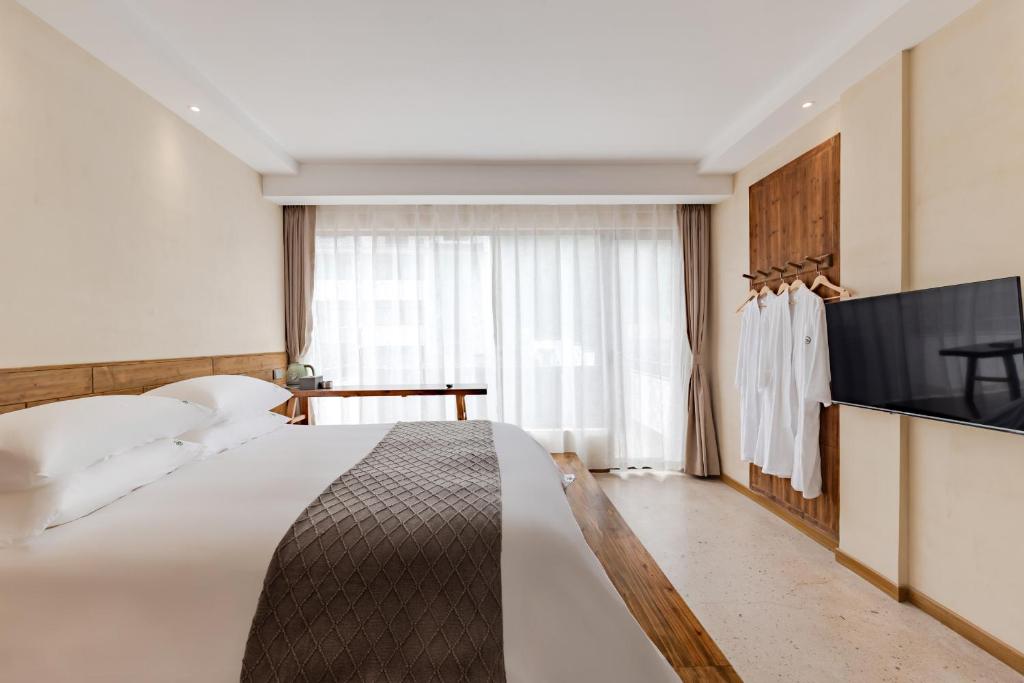 Letto o letti in una camera di 问安民宿（黄山风景区店）
