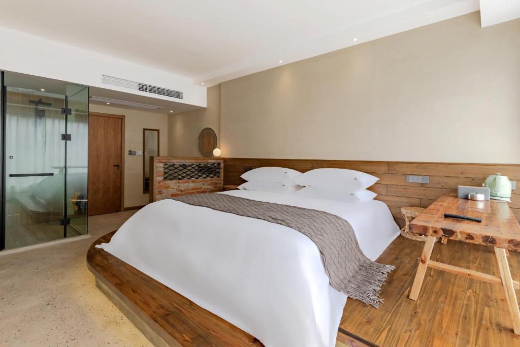 Letto o letti in una camera di 问安民宿（黄山风景区店）