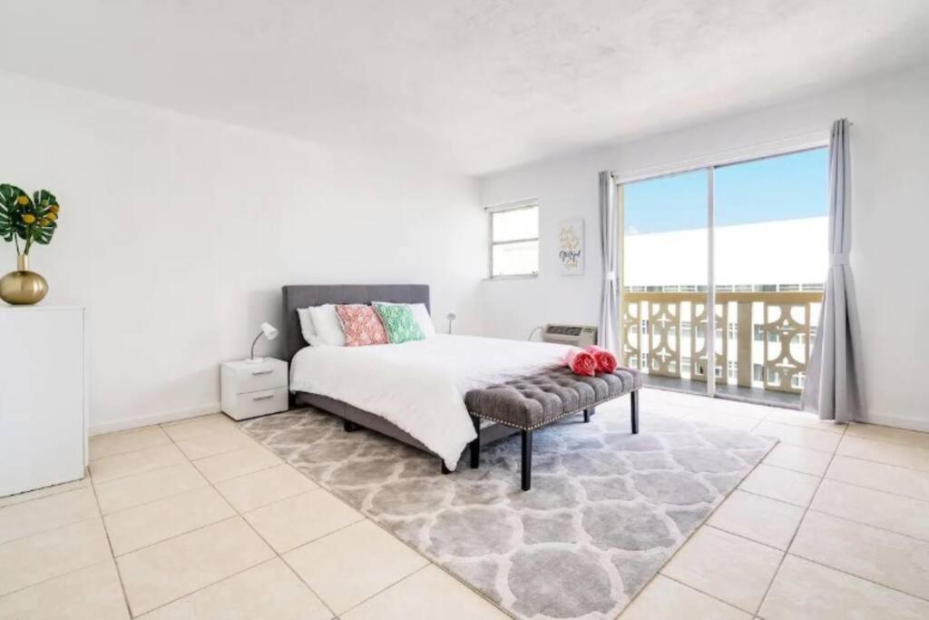 a bedroom with a bed and a large window at Scenic 1BR 1BA Retreat with Amazing Views in Miami Beach