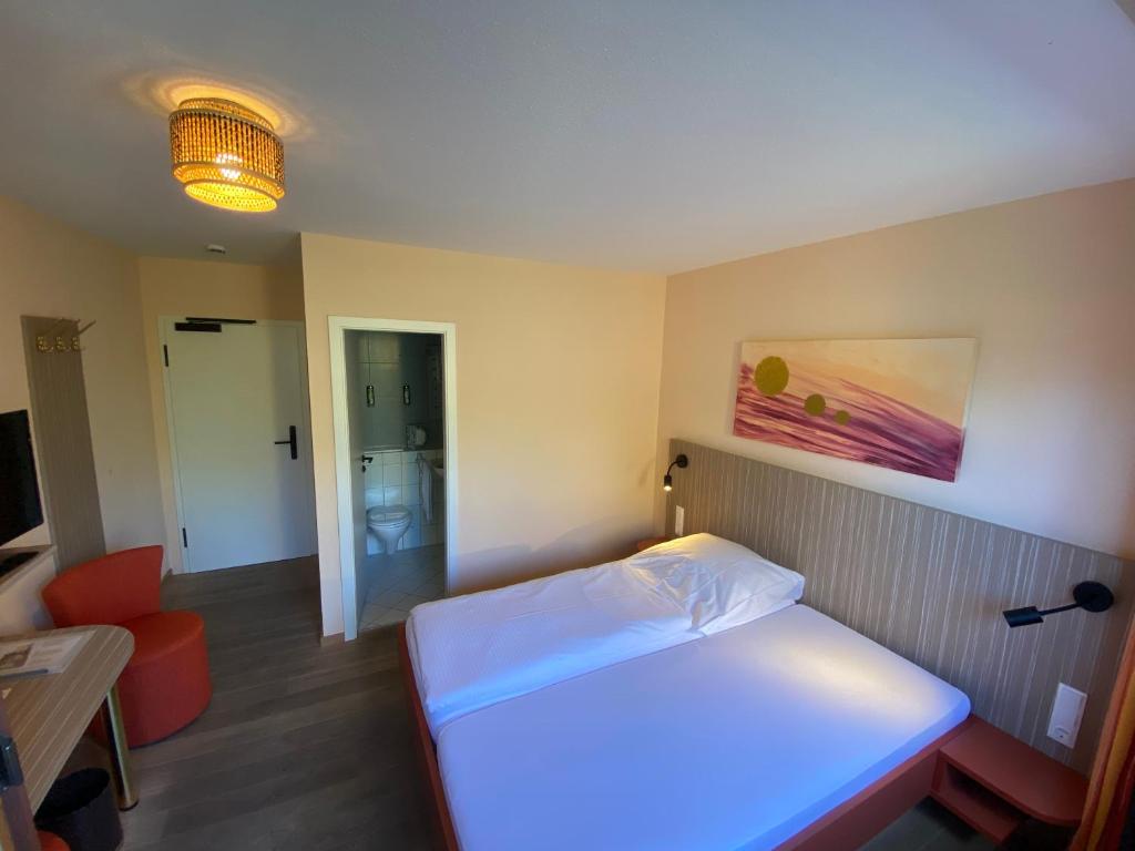 Postel nebo postele na pokoji v ubytování Wohlfühlhotel Sonnengarten