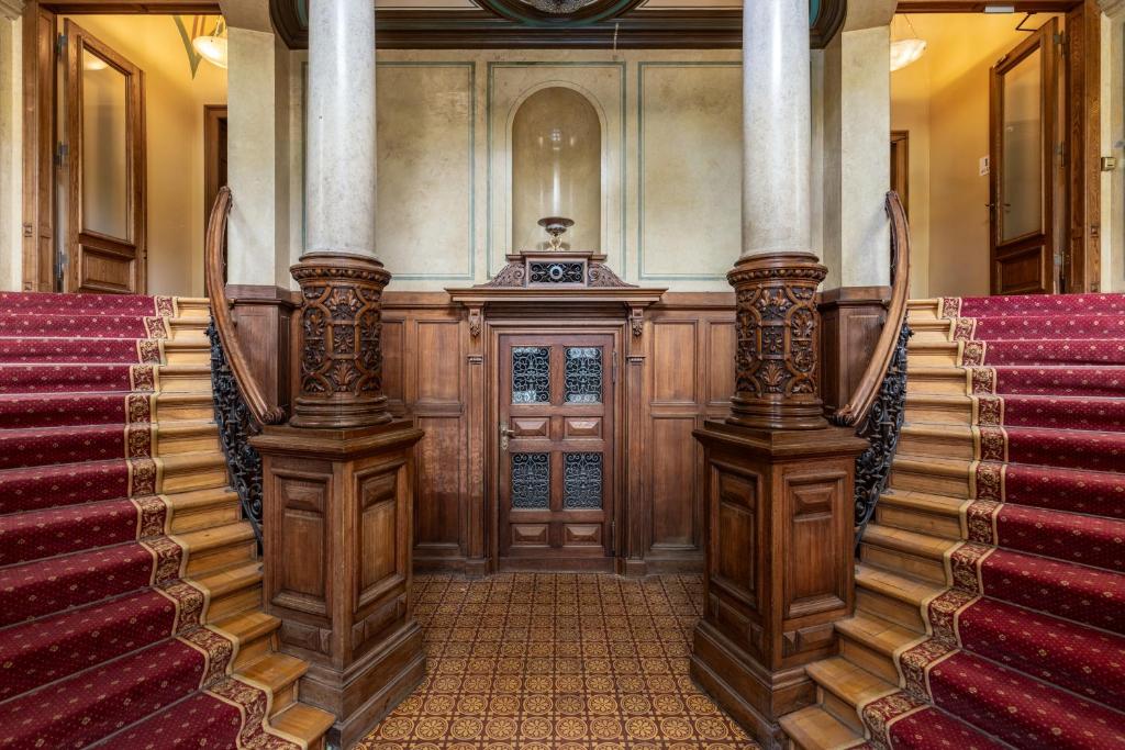 an entrance to a building with stairs and a stage at The Benjamin House in Rīga