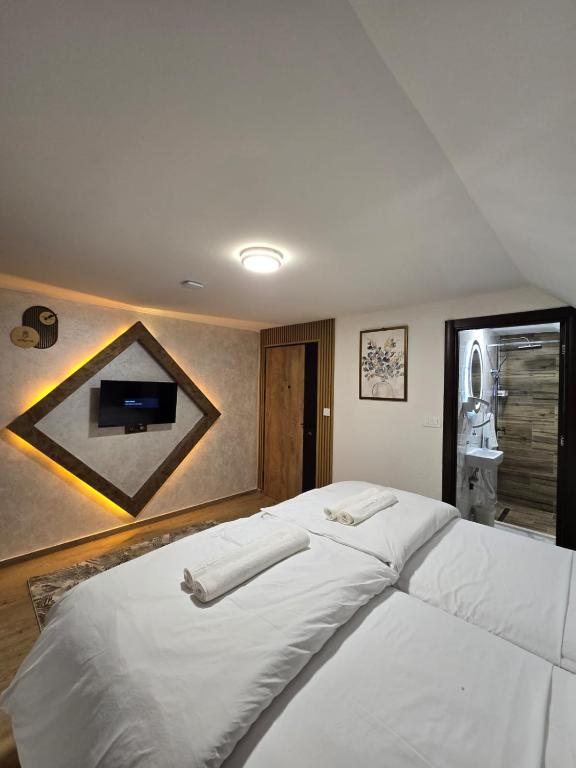 Postel nebo postele na pokoji v ubytování Hotel Mažijanik