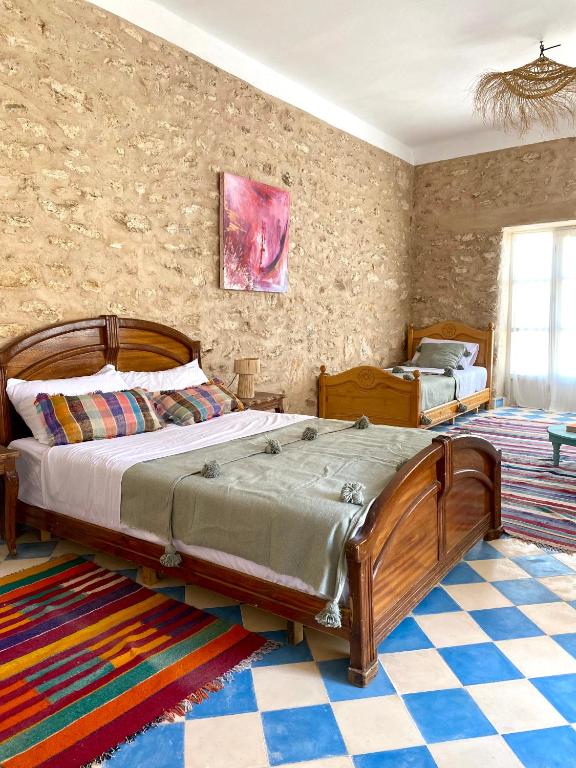 Postel nebo postele na pokoji v ubytování Adam house