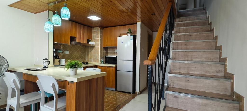Kuchyň nebo kuchyňský kout v ubytování Chaoyang Joy City Hardcover Apartment