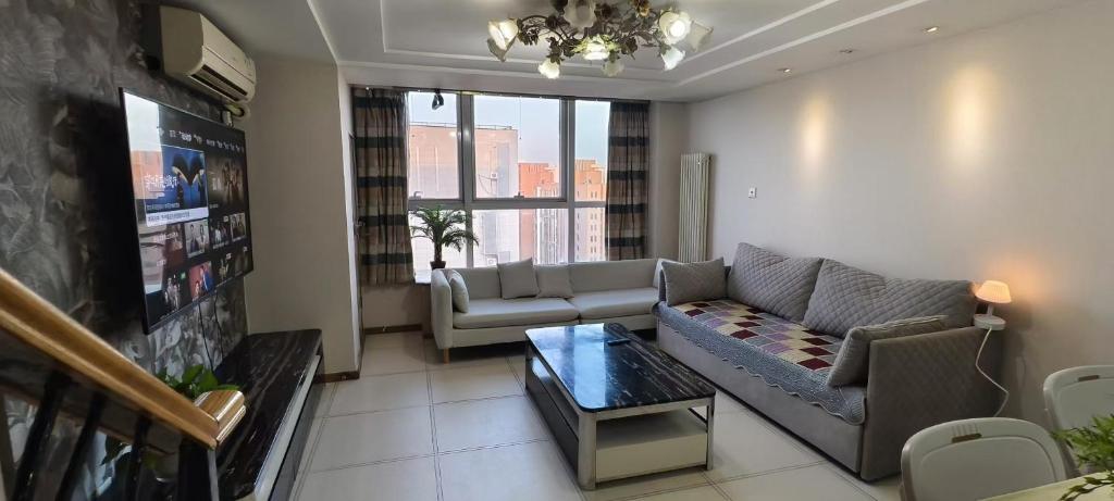 Posezení v ubytování Chaoyang Joy City Hardcover Apartment