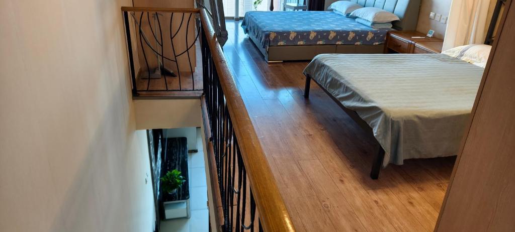 Postel nebo postele na pokoji v ubytování Chaoyang Joy City Hardcover Apartment