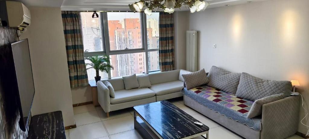 Posezení v ubytování Chaoyang Joy City Hardcover Apartment
