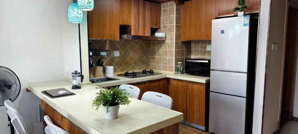 Kuchyň nebo kuchyňský kout v ubytování Chaoyang Joy City Hardcover Apartment