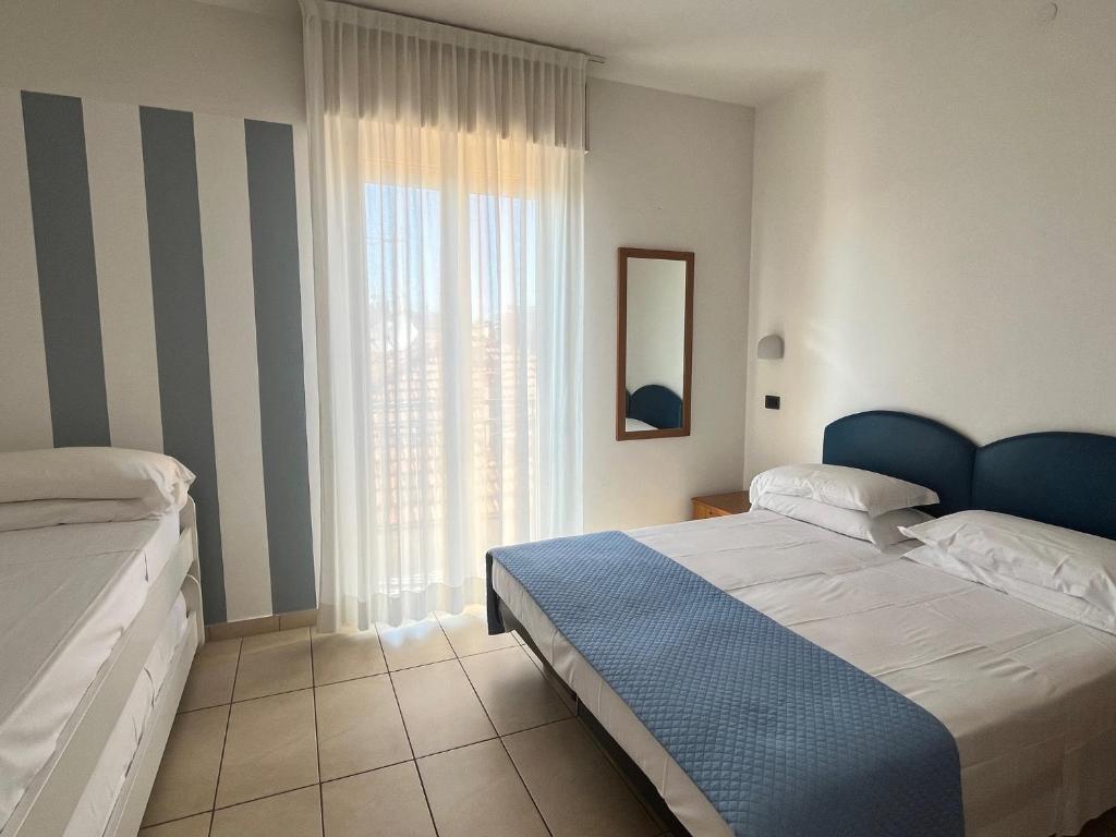 Postel nebo postele na pokoji v ubytování Hotel Berenice