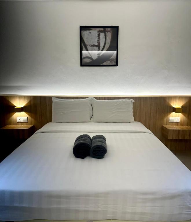 Postel nebo postele na pokoji v ubytování Mangrove Hotel Tawau