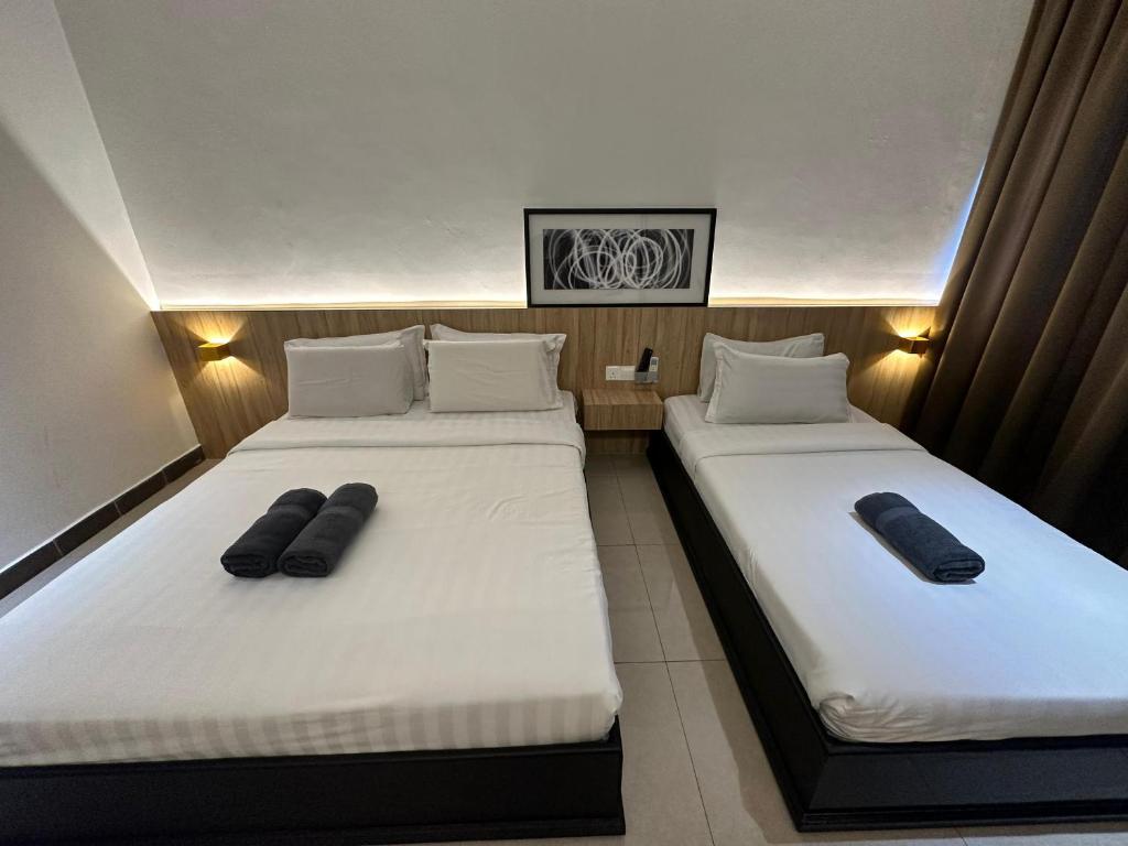Postel nebo postele na pokoji v ubytování Mangrove Hotel Tawau