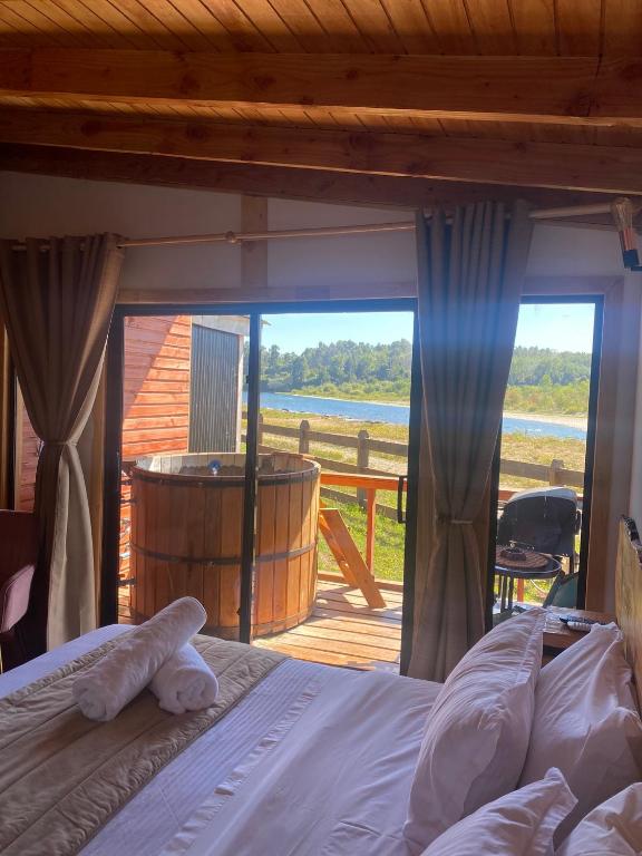 Postel nebo postele na pokoji v ubytování El Encanto de Antilhue